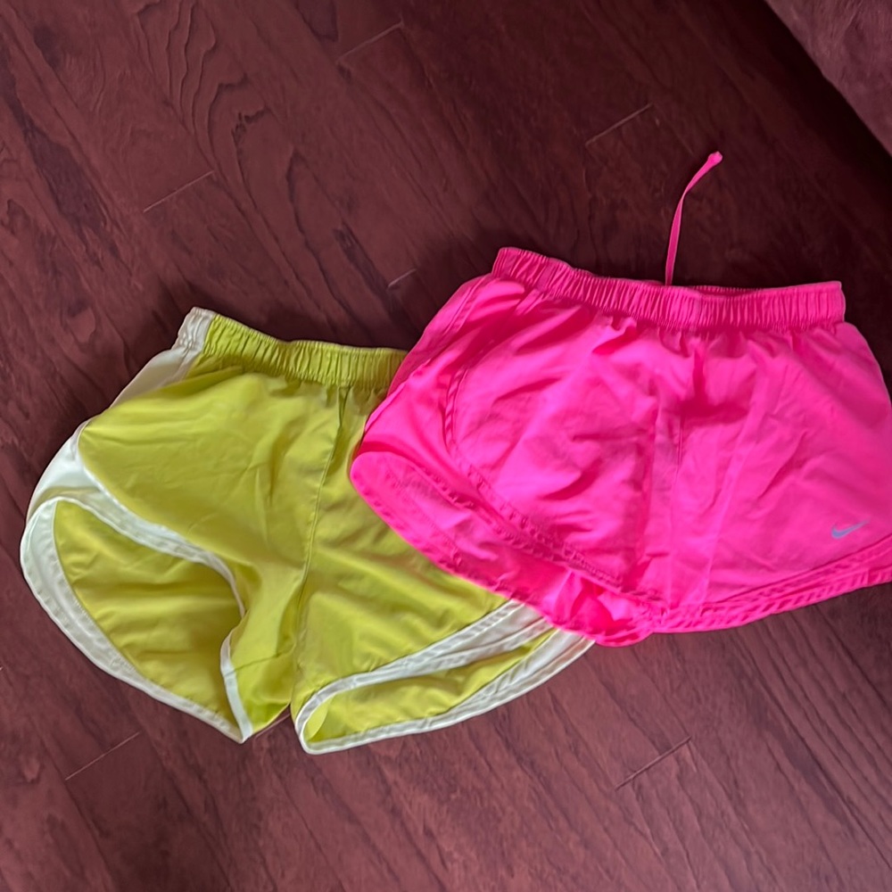 Neon pink and neon lime Nike running shorts , cute